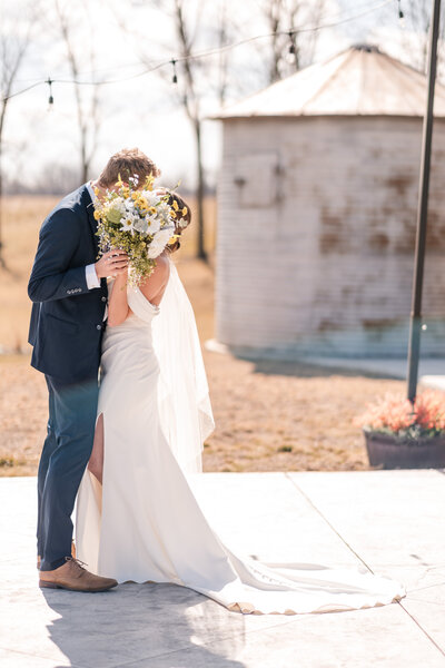 Newlyweds kissing at their wedding