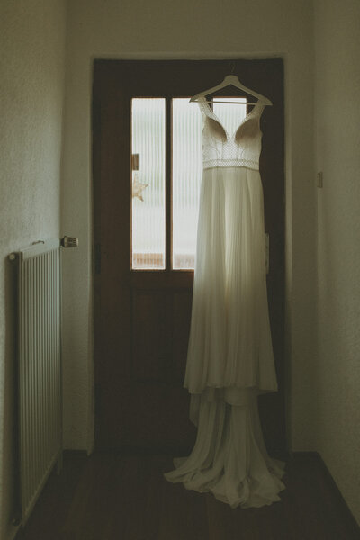brides dress hanging: vancouver wedding photographer