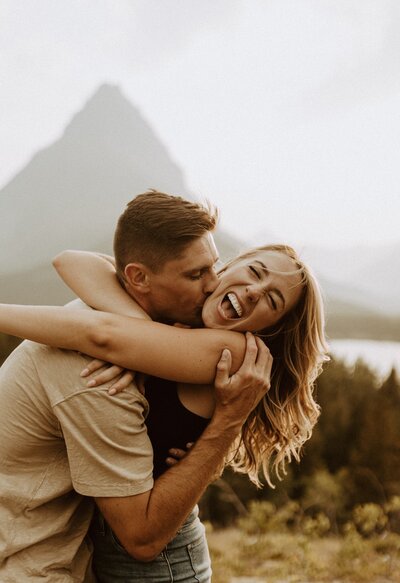 couple hugging on hiking trail