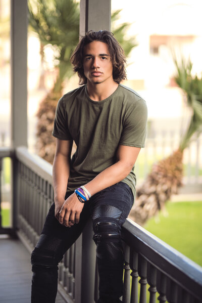 High School Senior Boy with dreadlocks and an LSU sweatshirt