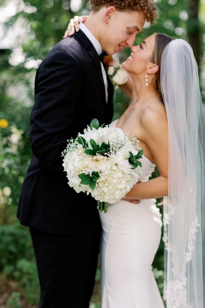 bride and groom pose at arkansas, usa wedding