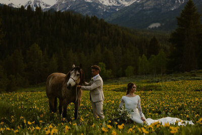 couple infront of horses