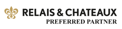 Logo with a gold fleur-de-lis design on the left, followed by the text "Relais &amp; Chateaux" in bold black letters. Below, smaller text reads "Preferred Partner.