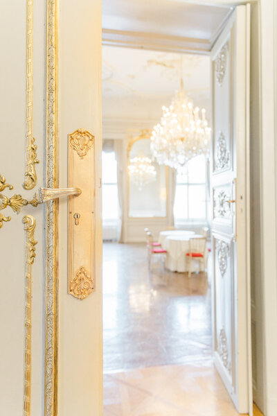 look through open doors to the heritage room at Palace Daun Kinsky in Vienna