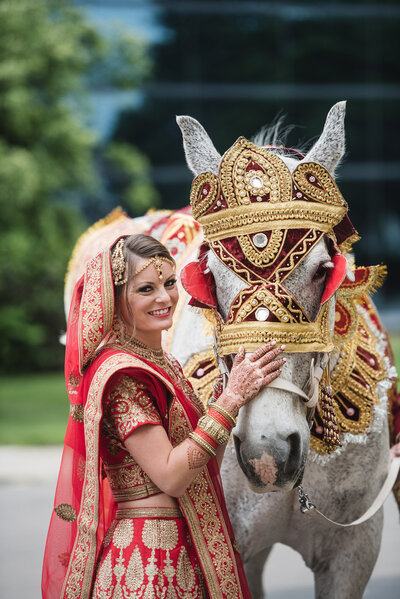 Bride with horse in Indian South Asian wedding in Michigan