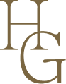 An olive green version of the Hannah Grace Photo logo. The Logo feautres a delicate handdrawn illustration of 2 buttes and the sun encased in an arch