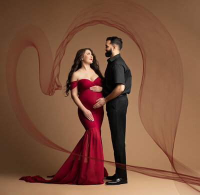 Pregnant woman in gown for maternity shoot in orlando