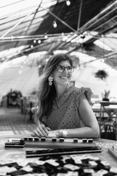 woman wearing sweater and leggings smiling standing in bathroom