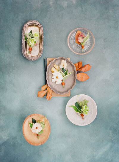 Boutonnieres on Dishes Flat Lay Photo