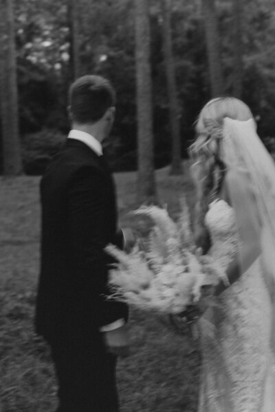 bride and groom facing away