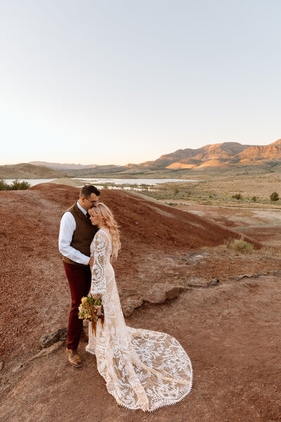 Couple embracing at the painted hills in Central Oregon.