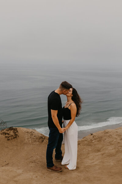 Engagement session in San Diego, CA. Couple on cliffs in La Jolla.