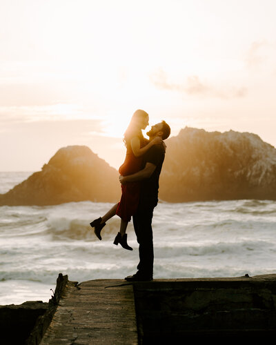Couple at Sutro Baths in SF at sunset.