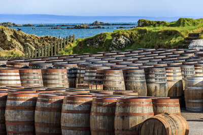 Whiskey barrels lined up on Isles of Islay