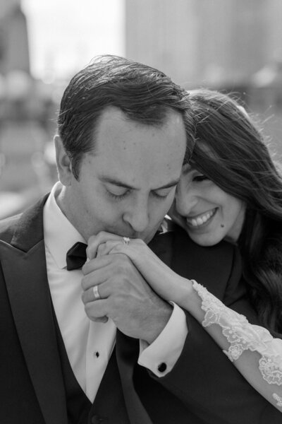groom kissing bride on the hand