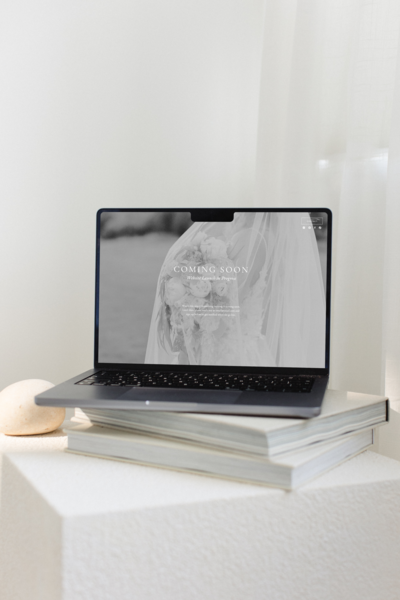 A laptop on top of linen books.