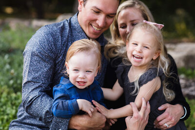 Minneapolis family hugging in Peace Gardens for a family photography session