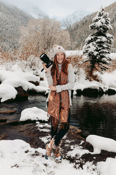 Telluride photographer  by the river in the snow.