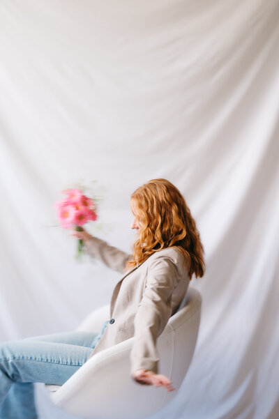 Emma, brand designer and website expert in a bright studio.