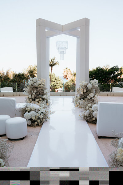 luxury wedding arch in a tropical wedding destination planned by suberry travel co