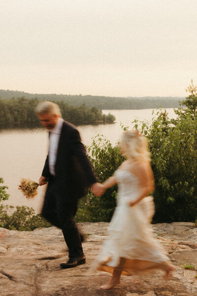 Motion blur of couple walking by on cliffside at their elopement