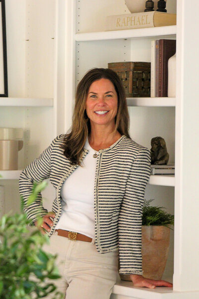 Woman standing in white kitchen