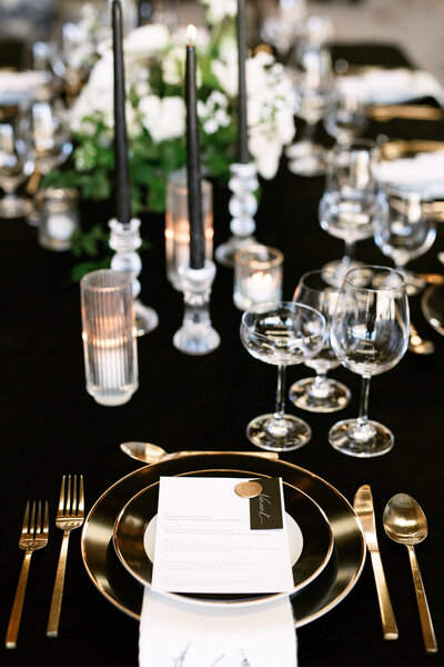 Luxe black, gold, and white, wedding reception dinner table