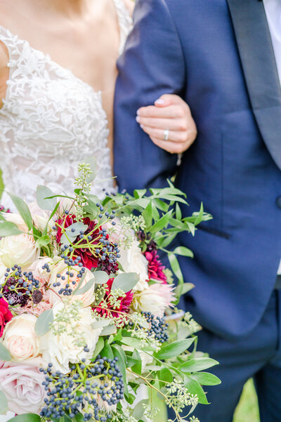 Bride and groom with bouquet on wedding day photographed by Baltimore Wedding Photographer