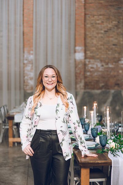The owner of Designed and Detailed poses for a headshot at a styled shoot at The Fairlie in Chicago