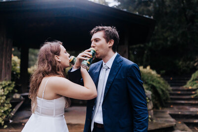 Destination Wedding Photographer captures bride and groom drinking beers together