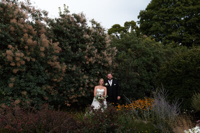 Bride and groom in a garden