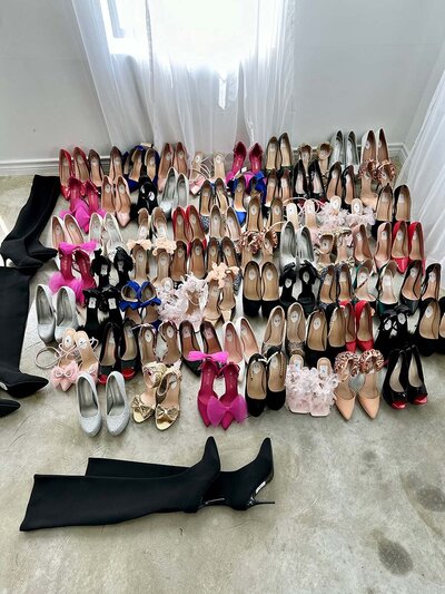 A collection of high heels and shoes arranged on the floor at boudoir by Amy.