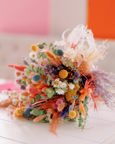 A colorful bouquet of flowers sitting on a table 