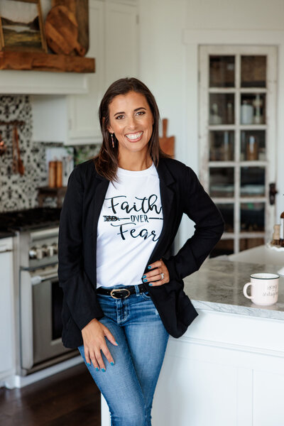 portrait of Orlando photographer standing in a kitchen for her brand photo with a casual and bright vibe
