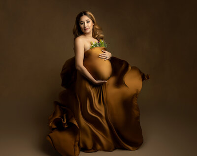 Maternity Photographer, pregnant woman in bronze colored dress