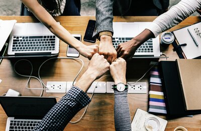 image of a hand with computers