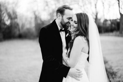 photo of groom kissing the brides shoulder taken at stanley house in lancashire