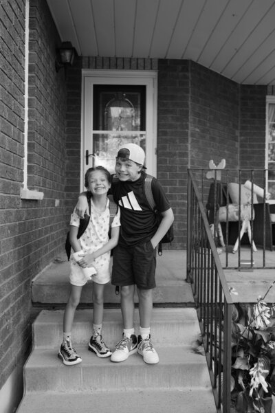 black and white photo of young boy and girl