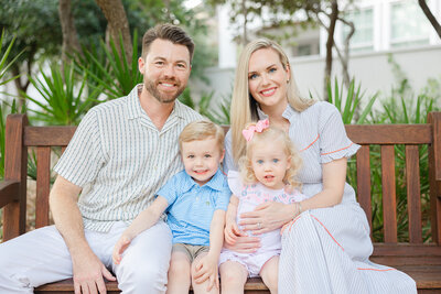 family photo on park bench in rosemary beach 30a