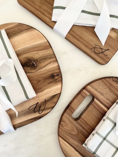 Cutting boards with wood burned monograms in calligraphy