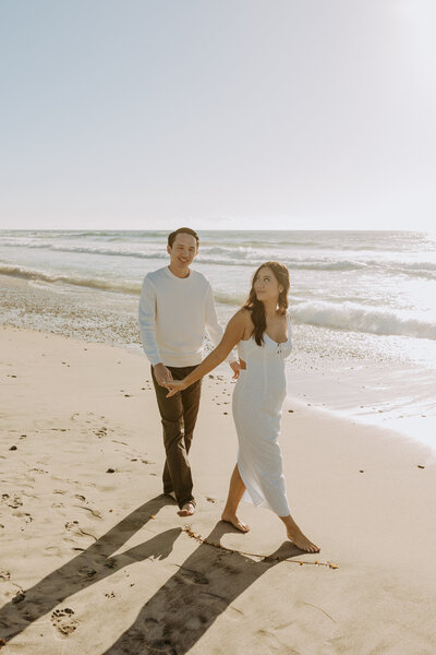 Natural Candid Documentary Family Maternity Baby Pregnancy Announcement Photo shoot at La Jolla Windansea beach at sunset - Couples Mom and Dad San Diego Maternity Photographer