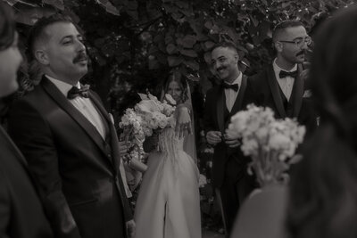 bride showing off her wedding ring in candid photo directly after wedding ceremony