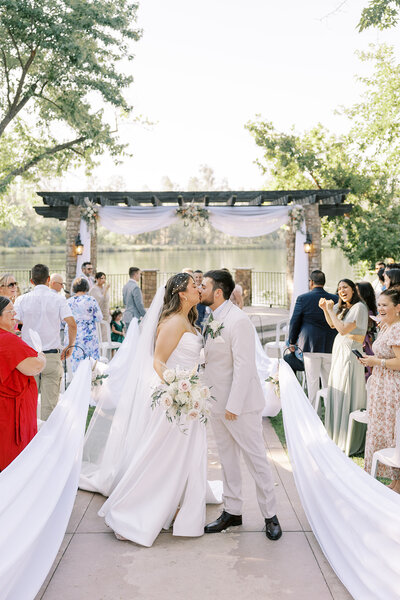 Bride and groom rejoice at their Lakeside ceremony at Wolf Lakes Park