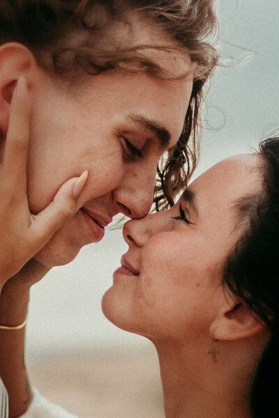 Close-up of bride and groom with their faces gently touching during a St. Augustine wedding.
