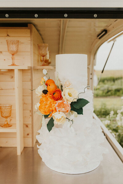 Tangerine wedding inspiration at the Gathered farm, cake by Yvonne's Delightful Cakes, classic cakes & desserts in Calgary, Alberta, featured on the Brontë Bride Blog.