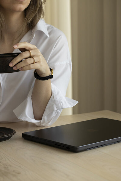 Woman with laptop and coffee