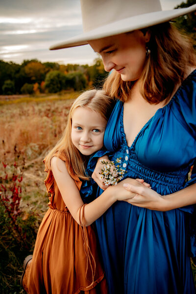 little girl hugging her mom at her family photoshoot in cleveland ohio