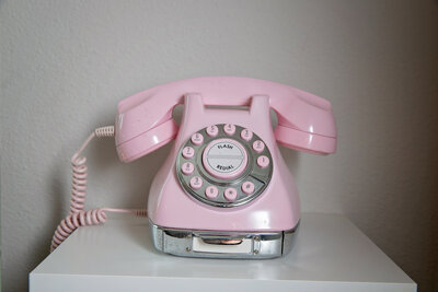 Pink old-fashioned telephone in Denver office - Pixel Lustre