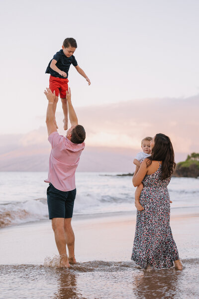 couple plays with their young children in Kihei Maui