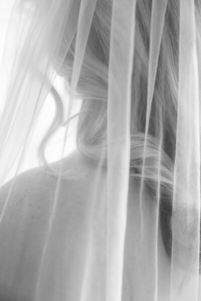 A young woman posing for a bridal boudoir portrait